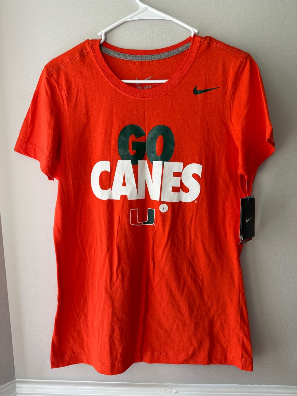 Nike Women's GO CANES T-Shirt in Orange with Green and White Graphics